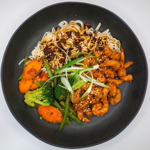 Honey garlic chili crisp shrimp noodles plated 500x500