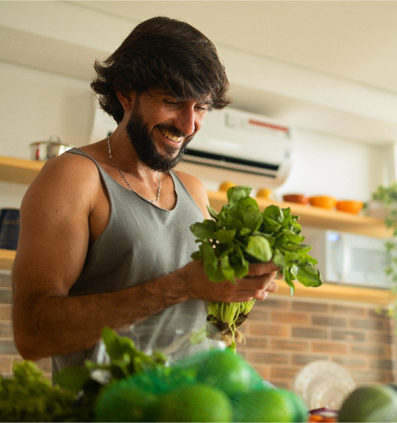 Healthy man holding fresh produce